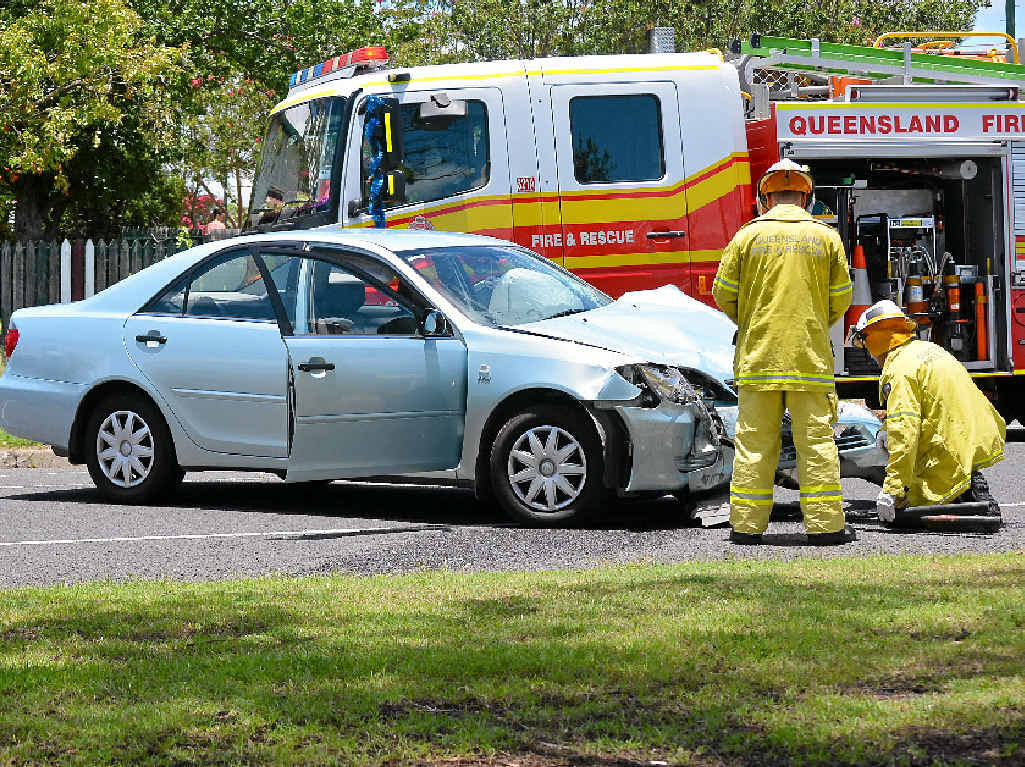 CRUNCH TIME: Warwick firefighters inspect a badly damaged Toyota Camry after a collision on the corner of Percy and Wallace Sts on Christmas Day. CRUNCH TIME: Warwick firefighters inspect a badly damaged Toyota Camry after a collision on the corner of Percy and Wallace Sts on Christmas Day.